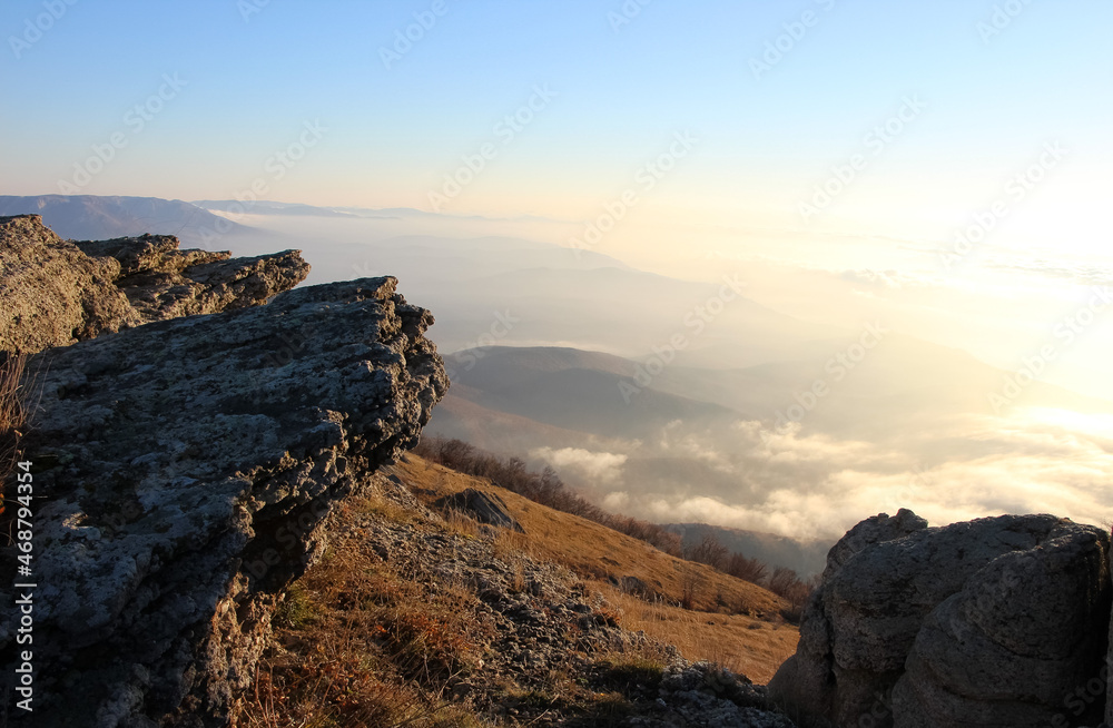 Sunrise in the mountains. Orange slopes of mountains and rocks
Sunrise in the mountains. Orange slopes of mountains and rocks
