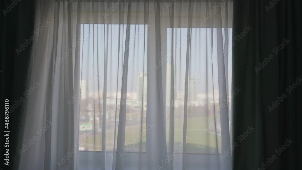 White thin curtain and green dense drape in interior decoration in living room with sunlight White thin curtain and green dense drape in interior decoration in living room with sunlight