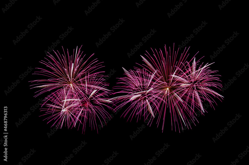 Fireworks on night sky, abstract light patterns. Black background with colorful, lightning effects. Long exposure and movement. Backdrops for Happy New Year cards, montage, copy space.	