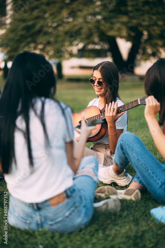 Smiling while preparing to play the guitar