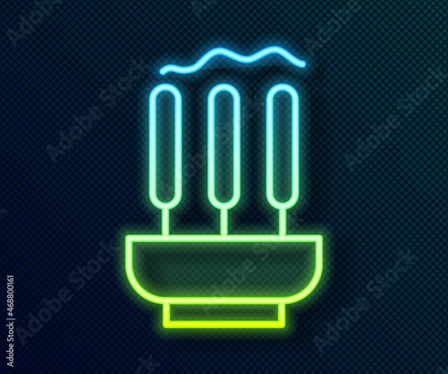 Glowing neon line Burning aromatic incense sticks icon isolated on black background. Vector