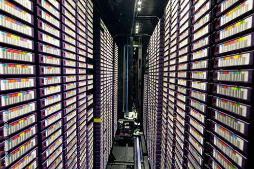 Data center with multiple rows of fully operational server racks photo