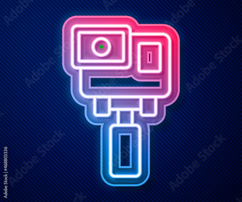 Glowing neon line Action extreme camera icon isolated on blue background. Video camera equipment for filming extreme sports. Vector