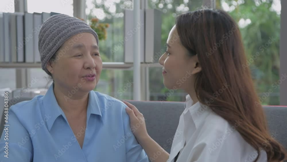 Family concept of 4k Resolution. Mother and daughter hugging in the living room.