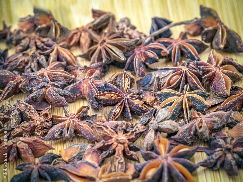 Dried anise stars on a wooden background. Close-up