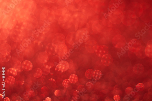 Bright bokeh. Blurred background with round bokeh. Bright bokeh in pattern. Bright ligts. Abstract blurred background. Red colors.