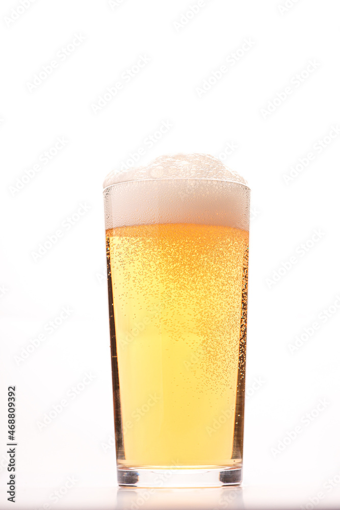 glass of fresh beer on white background glass of fresh beer on white background
