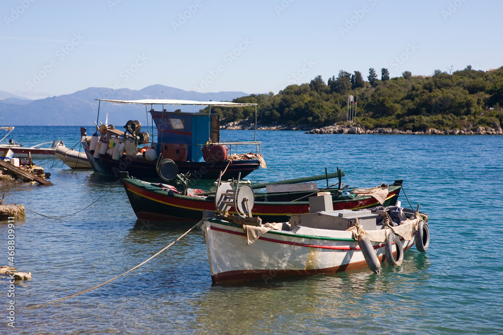 Traditional Greek fishing boats in the harbour at Mongonissi (otherwise known as Limeniskos Ozia or Port Ozias Bay), Paxos, Ionian Islands, Greece