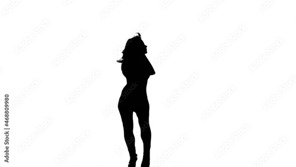 A Silhouette Woman Is Casually Dancing Against A White Background A Silhouette Woman Is Casually Dancing Against A White Background