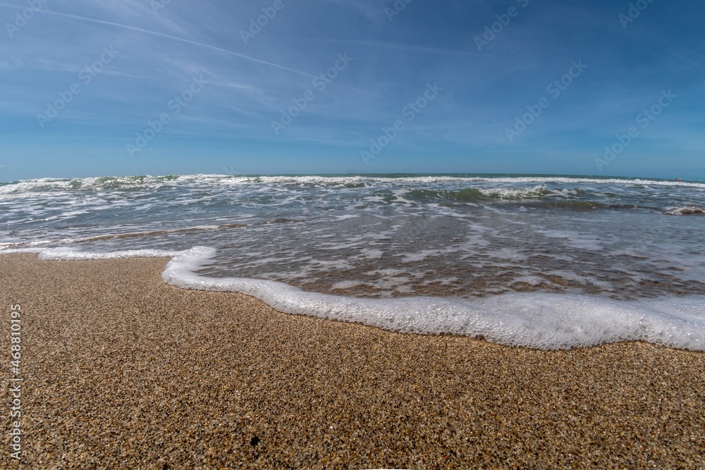 Sea with waves in the foreground on the shoreline Sea with waves in the foreground on the shoreline