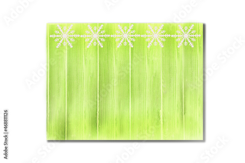 Winter wooden green grass herbal yellow nature background with snowflakes top. Texture of painted wood vertical boards on a white background. Christmas  New Year card with copy space.