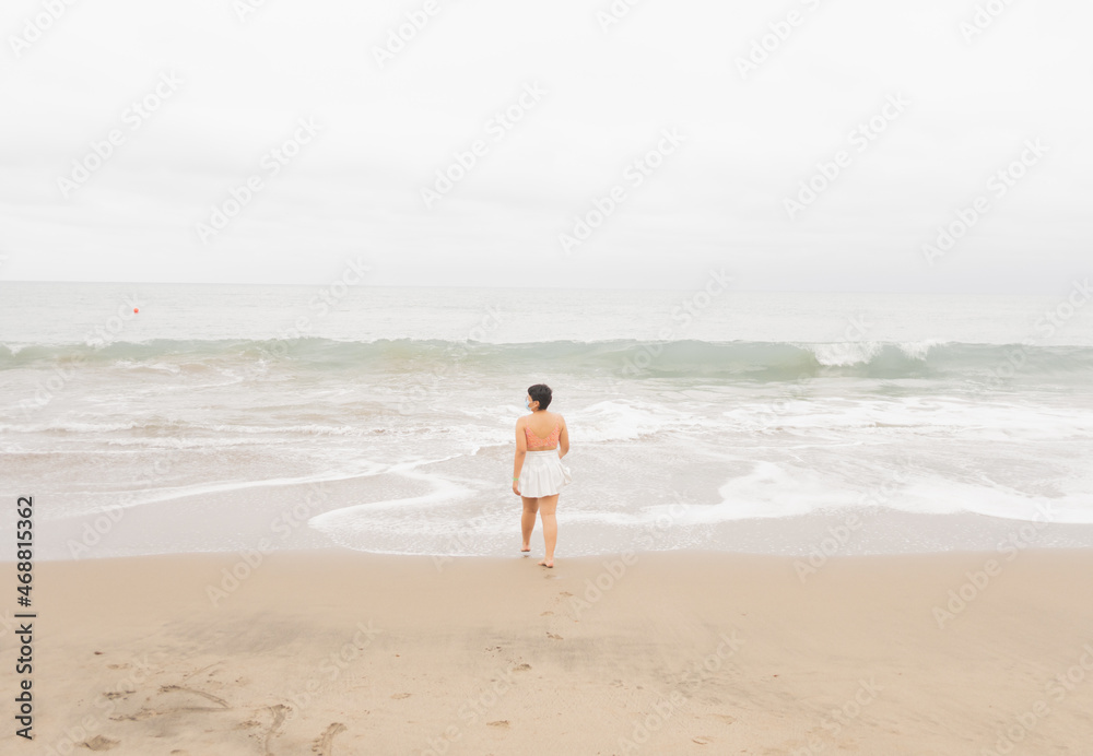 Young woman on a beautiful beach.