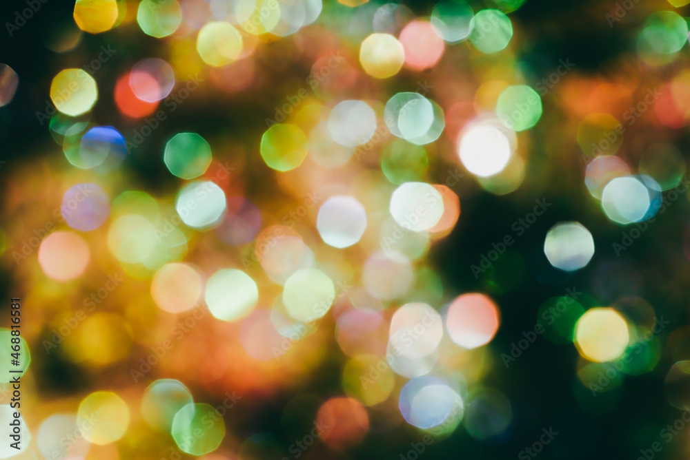 Beautiful natural bokeh of the colorful lights. Abstract Christmas New Year backdrop for text or advertising. Template for banner or party invitation Beautiful natural bokeh of the colorful lights. Abstract Christmas New Year backdrop for text or advertising. Template for banner or party invitation