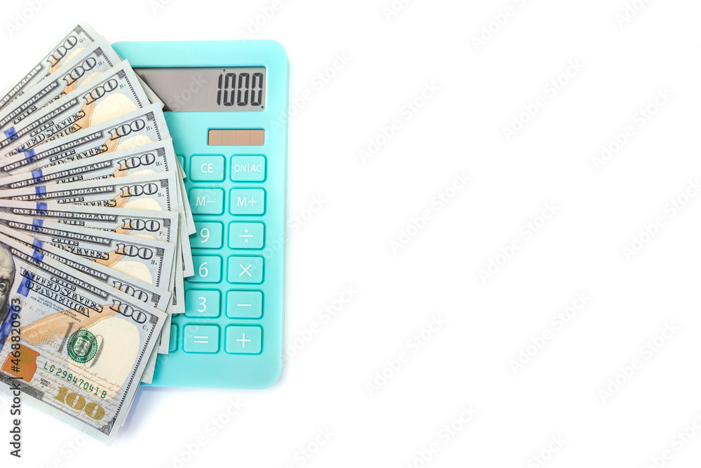 dollars and blue calculator isolated on white background dollars and blue calculator isolated on white background