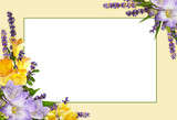 Purple and yellow freesia flowers in a corner floral arrangements with empty card on yellow