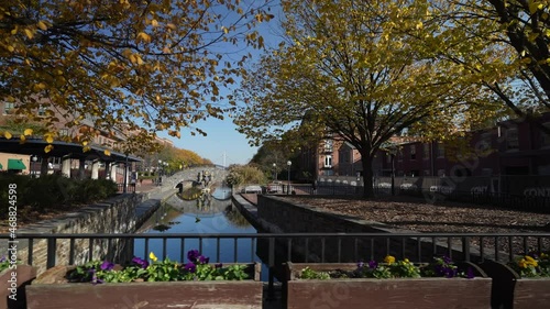 Carroll Creek Park in historic district of Frederick with shops and building on sides of the canal. photo