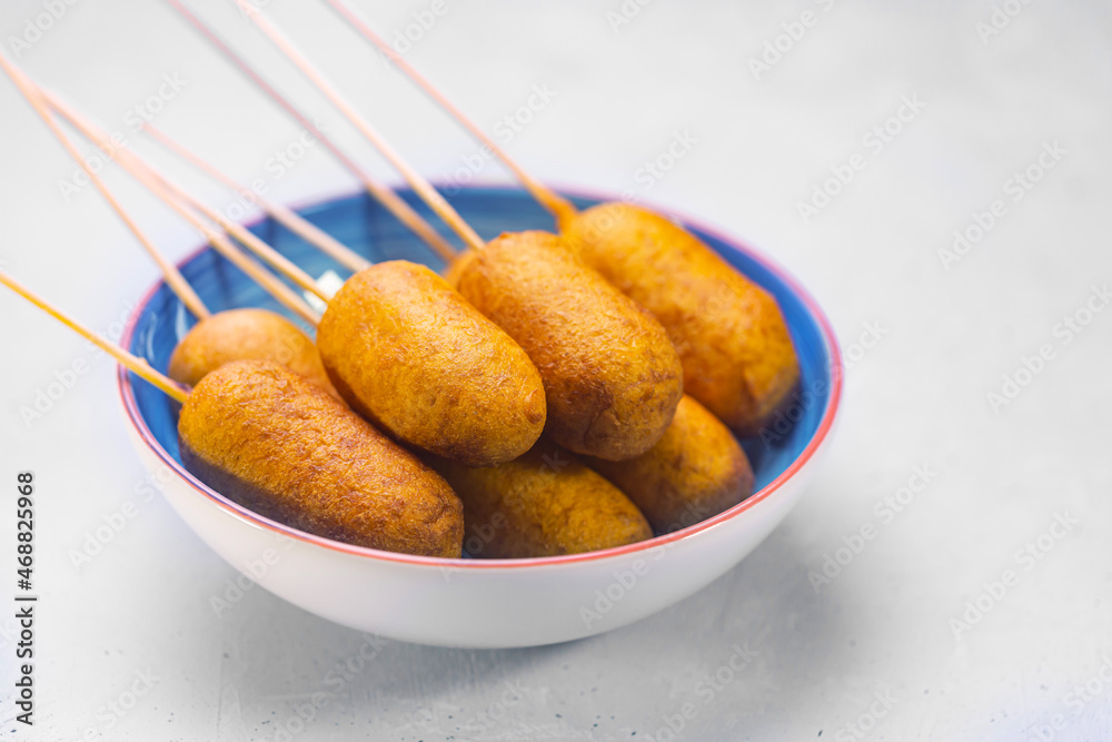 Corn dogs cooked with sausage and dough, side view - obrazy, fototapety, plakaty 