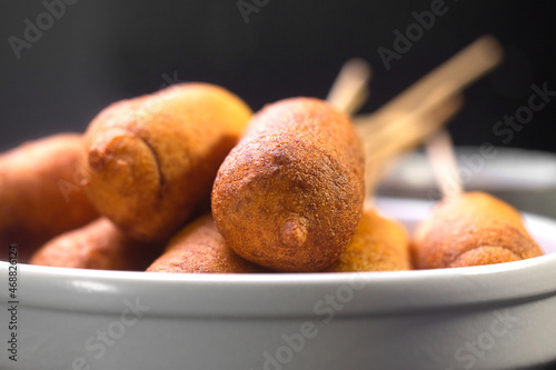 Corn dogs cooked with sausage and dough photo