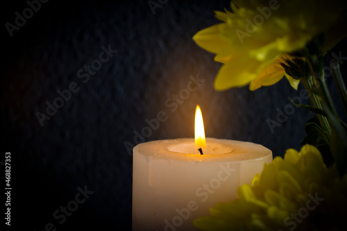 chrysanthemum flower candle on a dark background