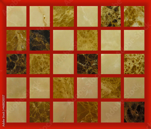 The texture of marble with square elements of yellow shades. Golden, brown and beige squares on a red background. 