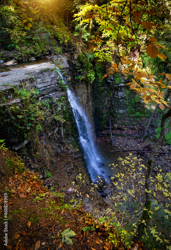 Beautiful waterfall among the canyon in the Carpathian mountains. Manyavsky waterfall.