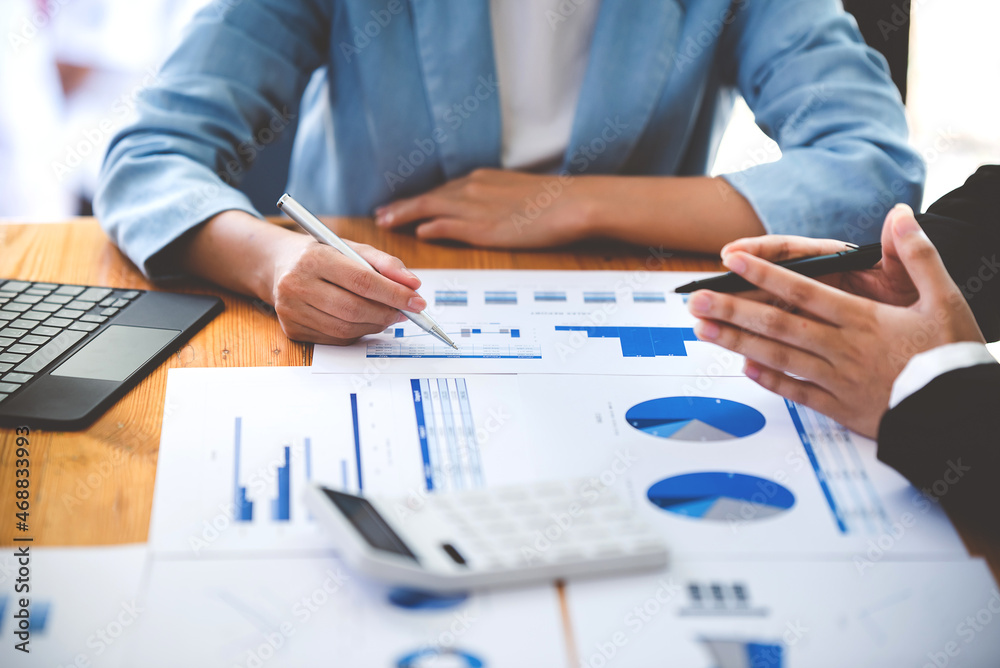 Team work with business analytic price chart on the table at the conference room. Team work with business analytic price chart on the table at the conference room.
