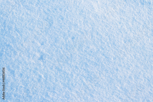 Uniform snow cover. Snow texture on a flat plot of land