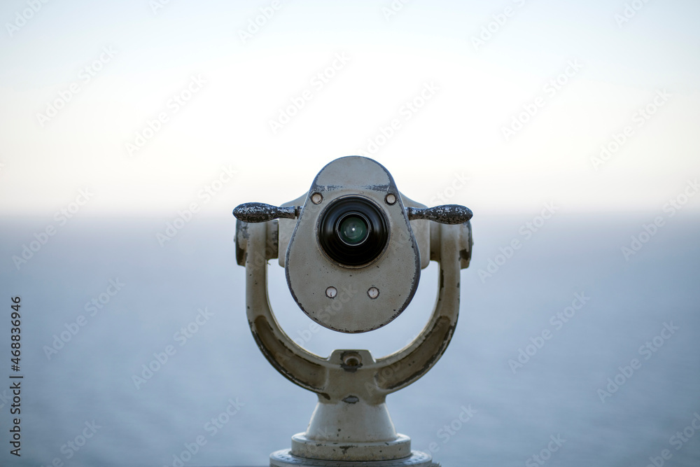 Monocle to look at a distance in front of the sea Monocle to look at a distance in front of the sea