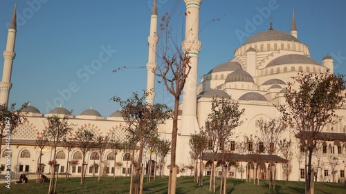 Views of the facades of mosque buildings and minarets, historical locations in the city of Istanbul. City streets in public places. photo