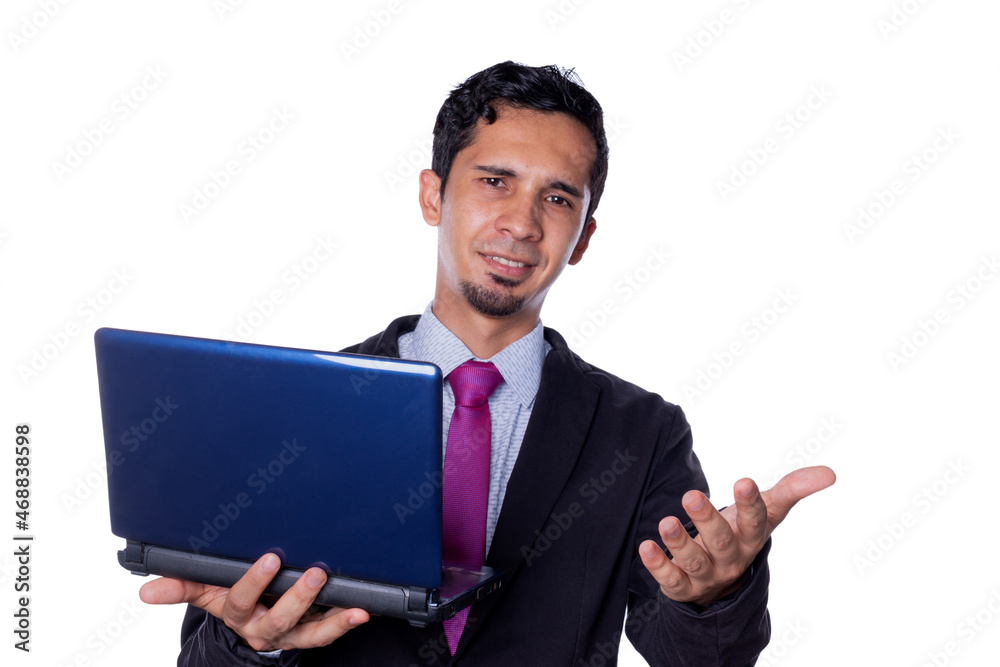 Smiling businessman waves and holds laptop in his hand. Latin man using technology, isolated on all white background. Concept of expressions in business. Smiling businessman waves and holds laptop in his hand. Latin man using technology, isolated on all white background. Concept of expressions in business.
