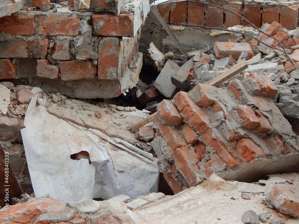 Fragments of a brick wall. Ruins of a demolished house. Fragments of a brick wall. Ruins of a demolished house.