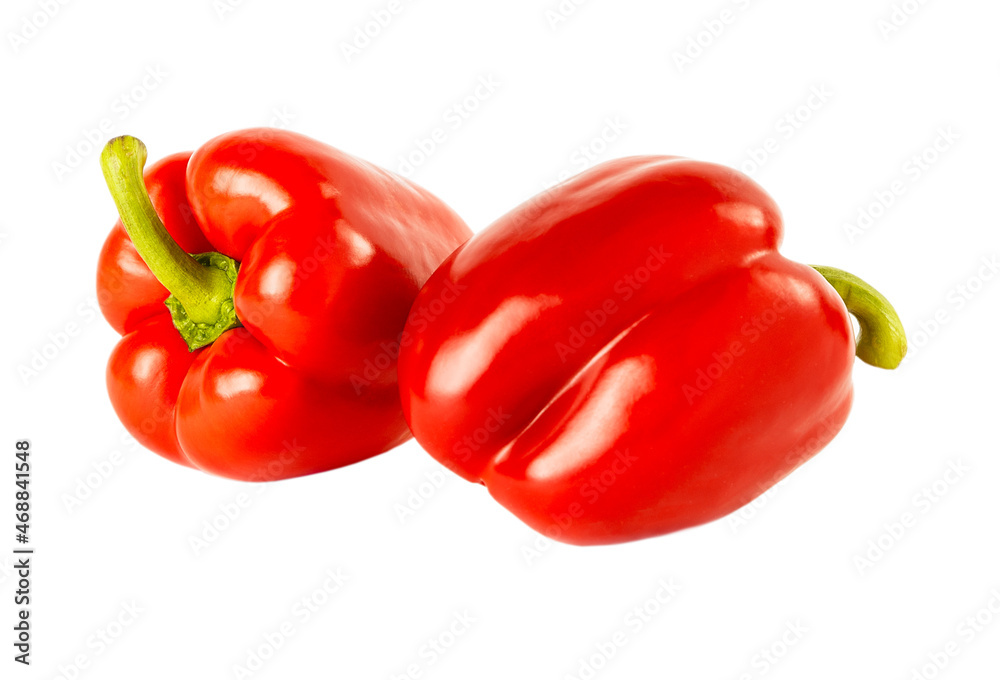 Two red bell peppers isolated on a white background. Two red bell peppers isolated on a white background.