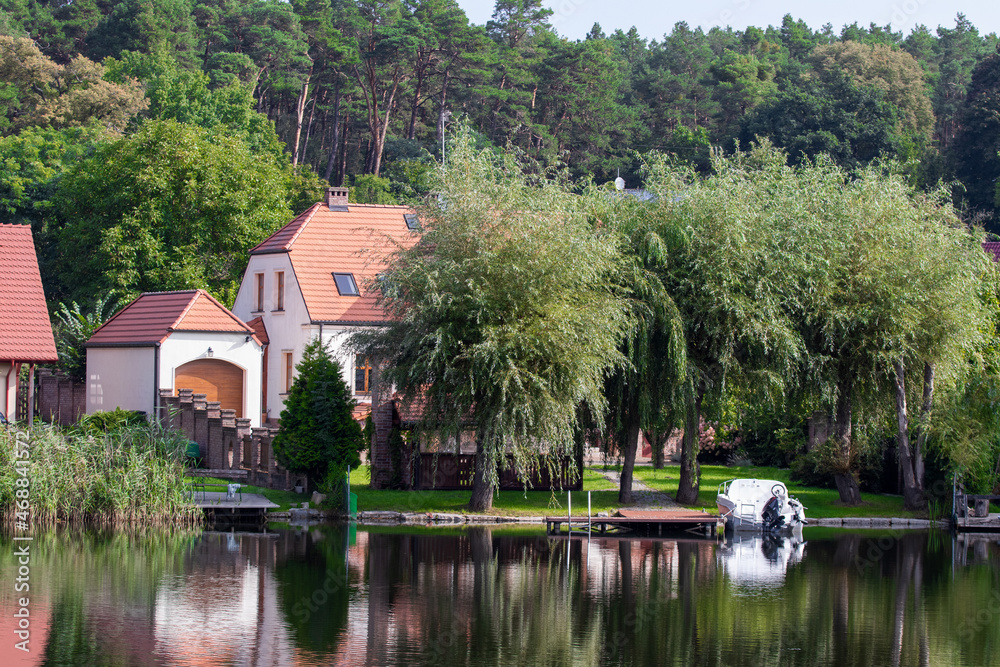 A lake overlooking a house in Lubniewice, Poland A lake overlooking a house in Lubniewice, Poland