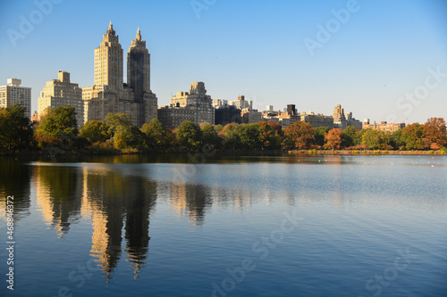 Central Park Reservoir or Jacqueline Kennedy Onassis Reservoir in New York city during the autumn season. Beautiful sunny day with warm weather and blue sky.