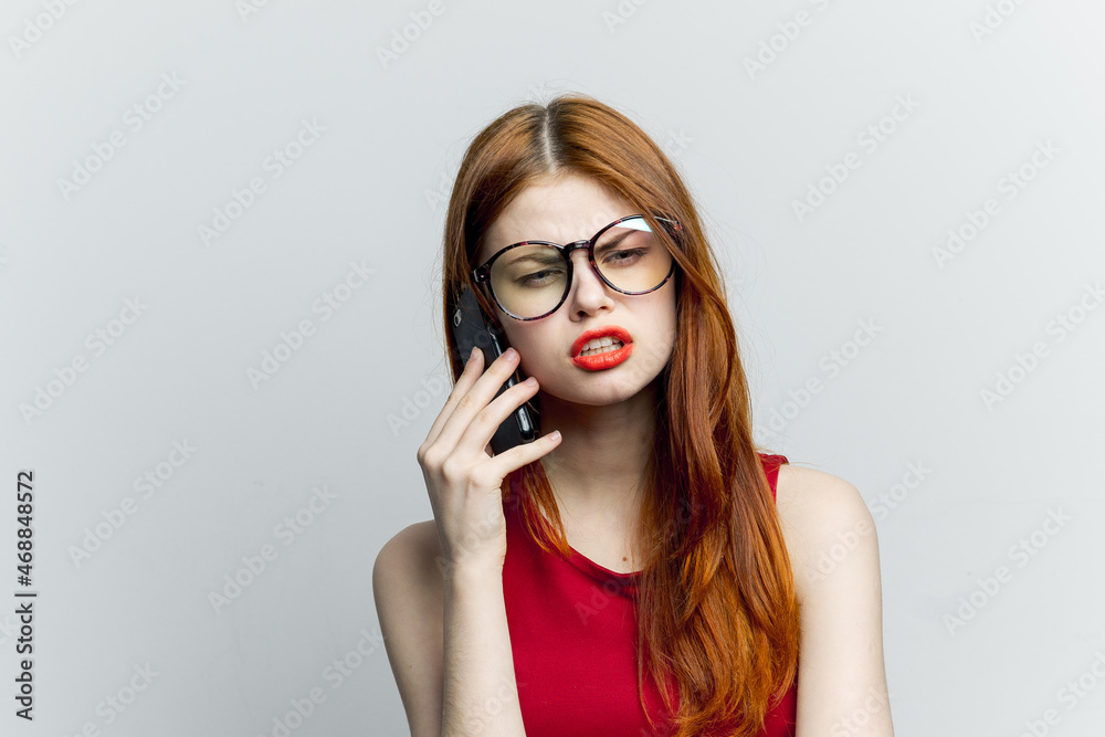 pretty woman with glasses talking on the phone technology lifestyle pretty woman with glasses talking on the phone technology lifestyle