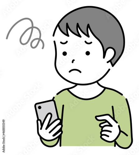 スマホを操作する困っている子供　男の子
