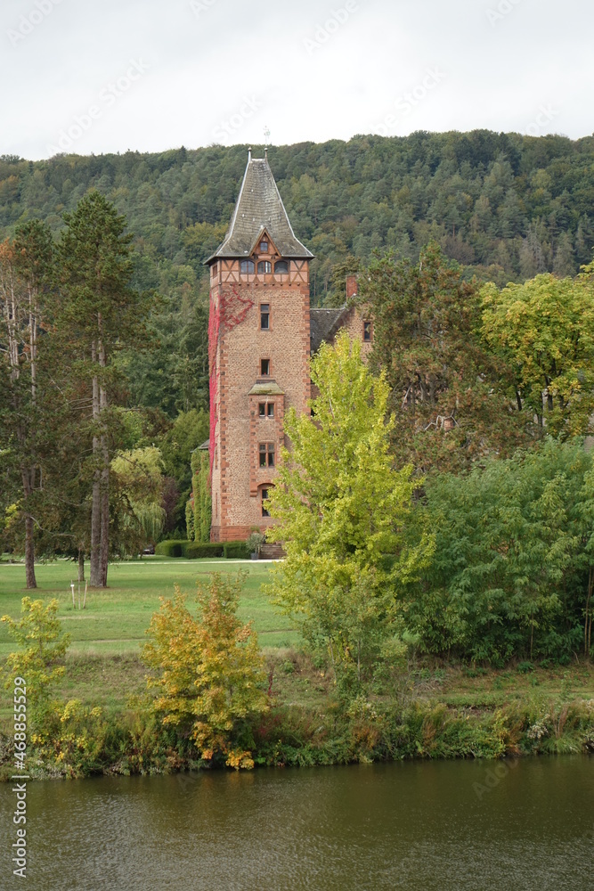 Old castle in a park at a river, Mettlach, Saarland, Germany
