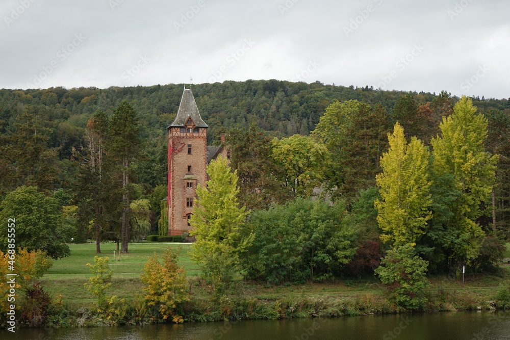 Old castle in a park at a river, Mettlach, Saarland, Germany
