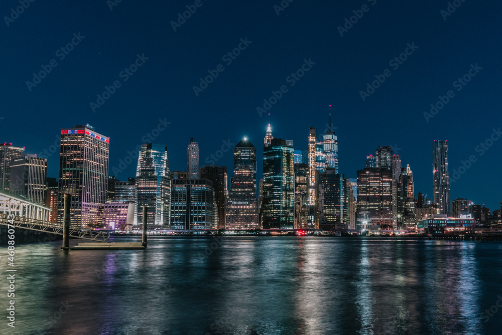 city skyline Manhattan New York beautiful reflections lights skyscrapers buildings bay 