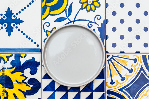 Plate on tile background