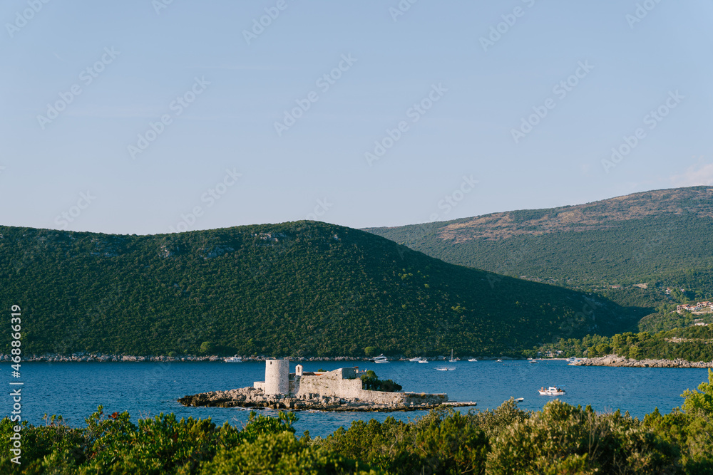 Island of Otocic Gospa in the bay. Montenegro