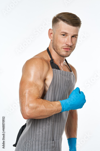 sporting man in aprons rubber homework gloves homework