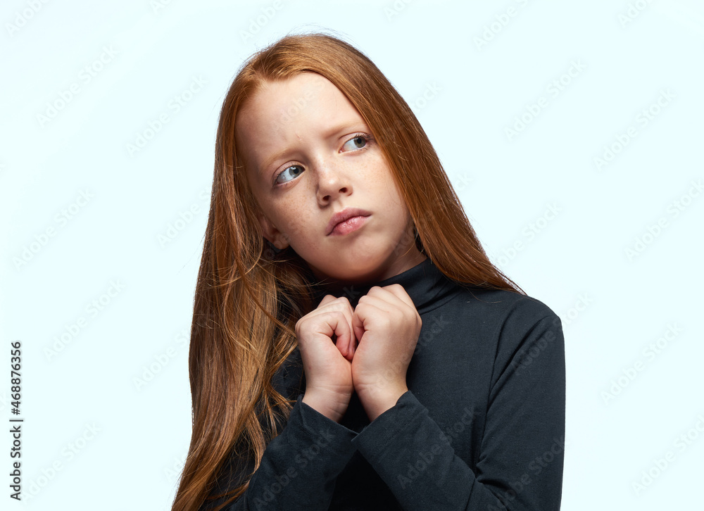red-haired girl in a black sweater planning close-up red-haired girl in a black sweater planning close-up