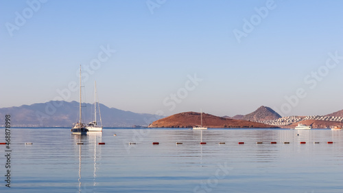 Beautiful sunrise on the Aegean Sea with islands, mountains and boats. High quality photo photo