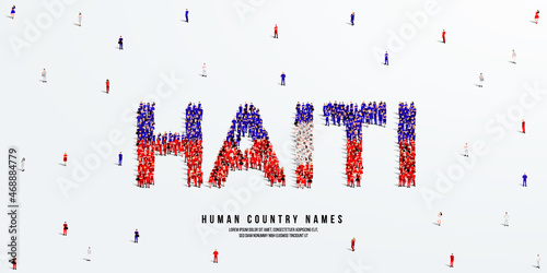 Foto A large group of people stands, making up the word Haiti