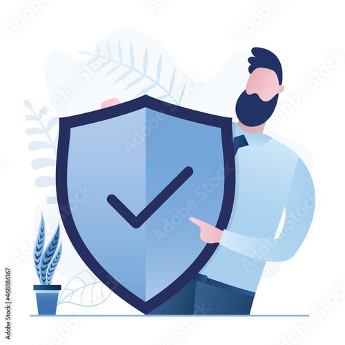 Businessman holds big protective shield. Security system. Manager with protect sign. Insurance or guarantee concept. Male character in trendy blue colors. photo
