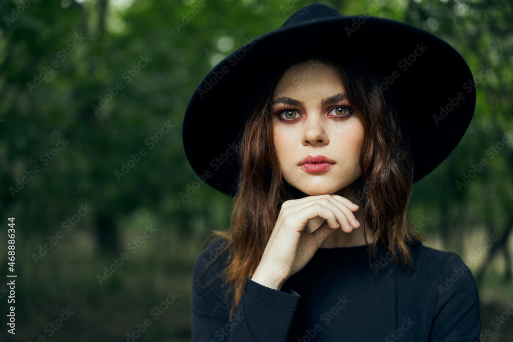 woman dressed as a witch in the forest Halloween fantasy ritual woman dressed as a witch in the forest Halloween fantasy ritual