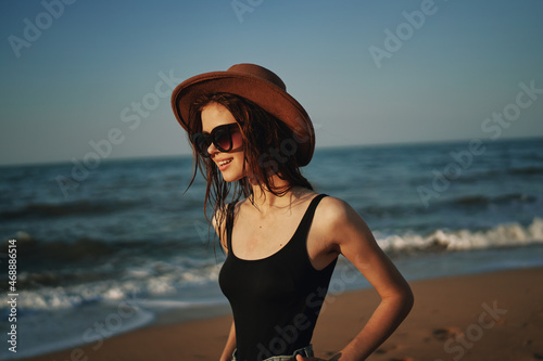 Wallpaper Mural pretty woman in hat walking on the beach ocean travel Torontodigital.ca