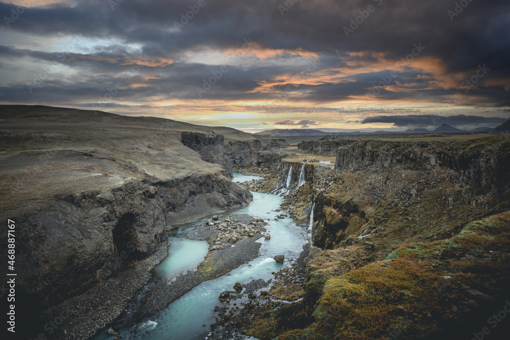 Beautiful sunset and landscape of Sigoldugljufur canyon with many small waterfalls and the blue river in Highlands of Iceland