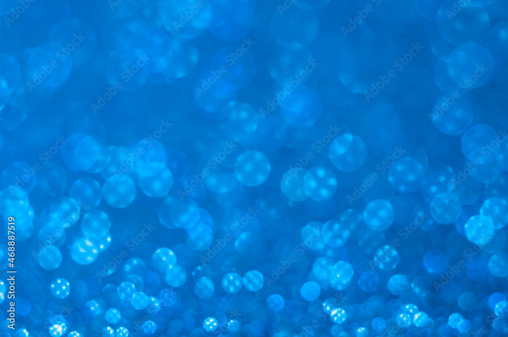 Bright bokeh. Blurred background with round bokeh. Bright bokeh in pattern. Bright ligts. Abstract blurred background. Blue bacgkround